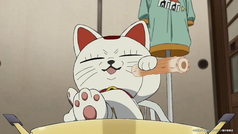 高速婆婆的招財貓造型可愛中帶點壞壞小心機。Photo/X@anime_dandadan